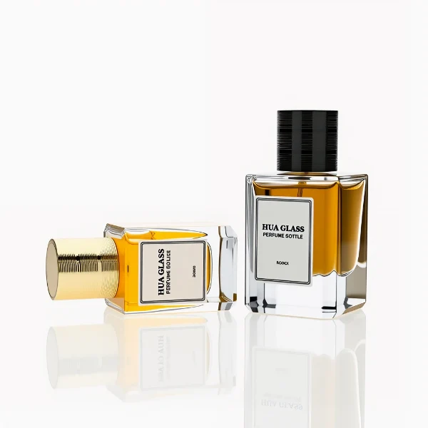 HUA0235 perfume bottle, square transparent glass body with thick base, 30 ml, 50 ml, or 100 ml liquid, cylindrical plastic cap with side threading and metallic finish in gold, black, or silver, brand label applied on bottle, modern luxurious design, ideal for gifting and daily use.