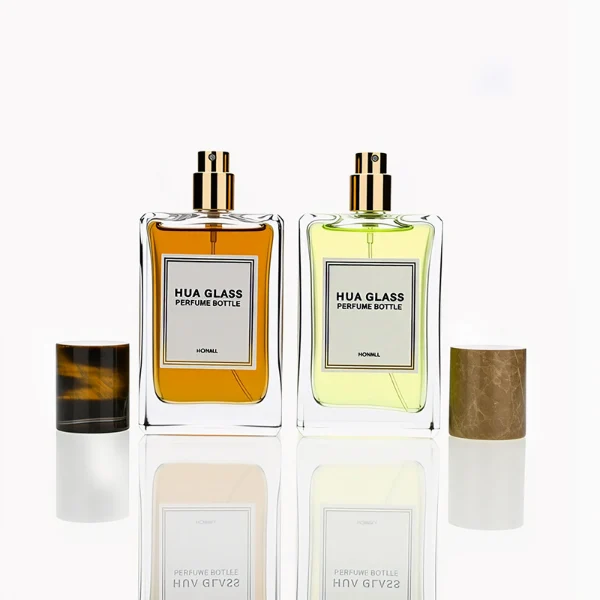 HUA0236 perfume bottle, square transparent glass body with thick base, 100 ml liquid, cylindrical natural stone cap, brand label applied on bottle, modern luxurious design, ideal for gifting and daily use.