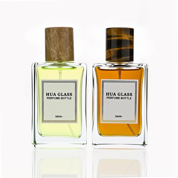 HUA0236 perfume bottle, square transparent glass body with thick base, 100 ml liquid, cylindrical natural stone cap, brand label applied on bottle, modern luxurious design, ideal for gifting and daily use.