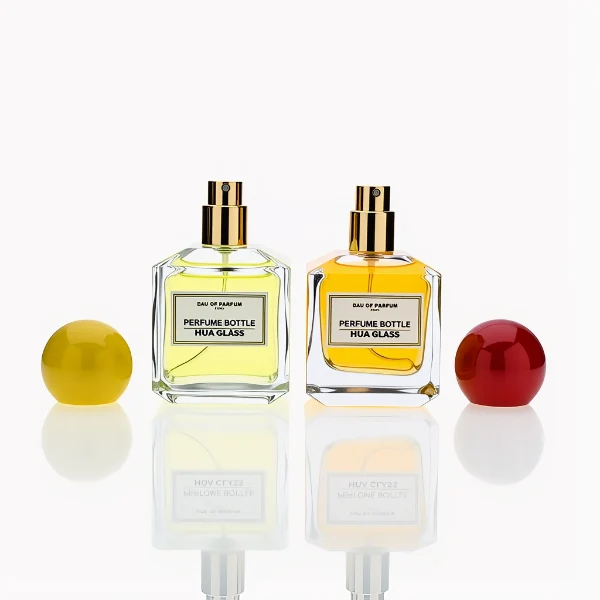 HUA0237 perfume bottle, square transparent glass body with thick base, 50 ml, 70 ml, or 100 ml liquid, spherical plastic cap, customizable, brand label applied on bottle, modern luxurious design, ideal for gifting and daily use.