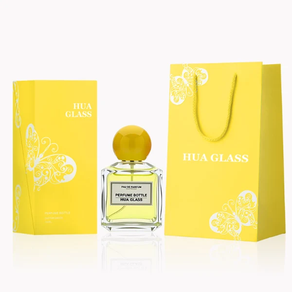 HUA0237 perfume bottle, square transparent glass body with thick base, 50 ml, 70 ml, or 100 ml liquid, spherical plastic cap, customizable, brand label applied on bottle, modern luxurious design, ideal for gifting and daily use.