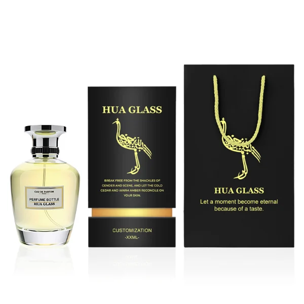 HUA0238 perfume bottle, kettle-shaped transparent glass body with thick base, 100 ml liquid, flat cylindrical metallic cap, top flat, bottom fitting the bottle neck, brand label applied on bottle, modern luxurious design, ideal for gifting and daily use.