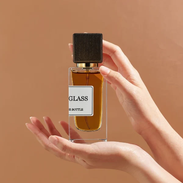 HUA0240 perfume bottle, square transparent glass body with thick base, 30 ml, 50 ml, or 100 ml liquid, square wooden cap with gold neck, brand label applied on bottle, modern luxurious design, ideal for gifting and daily use.