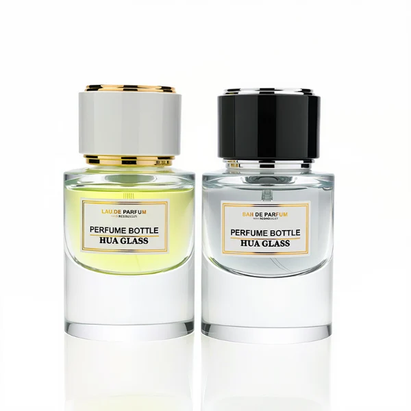 HUA0242 perfume bottle, cylindrical transparent glass body with thick base, 30 ml, 50 ml, or 100 ml liquid, cylindrical plastic cap with black or white side and silver plastic rings on both top and bottom, brand label applied on bottle, modern luxurious design, ideal for gifting and daily use.