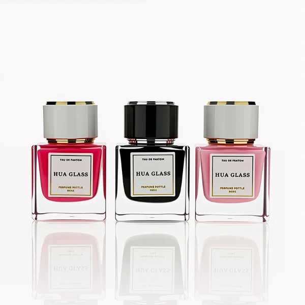 HUA0243 perfume bottle, cylindrical transparent internal spray glass body with thick base, 30 ml, 50 ml, or 100 ml liquid, cylindrical plastic cap with black or white side and gold or silver plastic rings on both top and bottom, brand label applied on bottle, modern luxurious design, ideal for gifting and daily use.