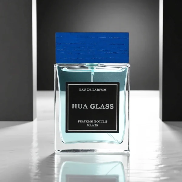 HUA0247 perfume bottle, rectangular transparent glass body with thick base, 100 ml liquid, rectangular wooden cap with customizable color, brand label applied on bottle, modern luxurious design, ideal for gifting and daily use.