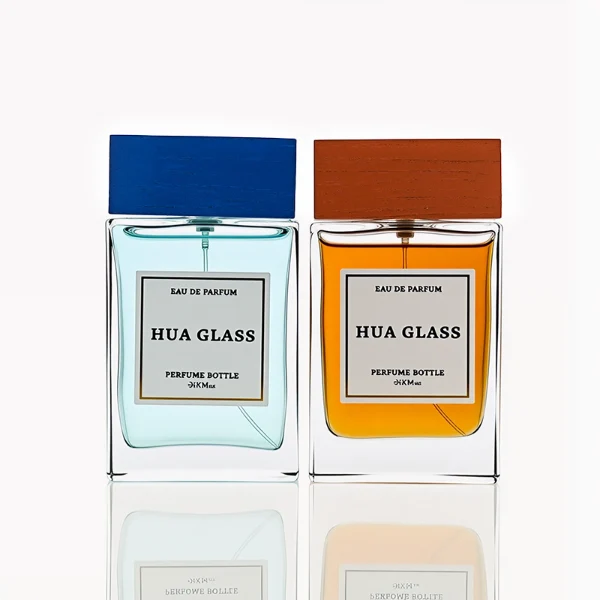 HUA0247 perfume bottle, rectangular transparent glass body with thick base, 100 ml liquid, rectangular wooden cap with customizable color, brand label applied on bottle, modern luxurious design, ideal for gifting and daily use.