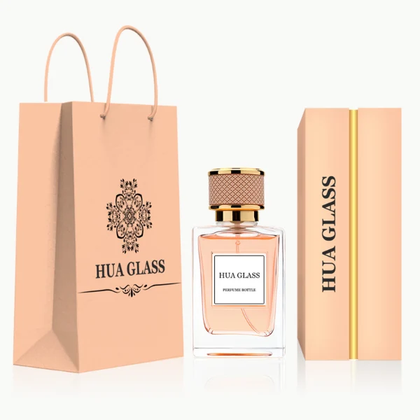 HUA0248 perfume bottle, rectangular transparent glass body with thick base, 50 ml or 100 ml liquid, cylindrical plastic cap wrapped with leather, gold-colored bottle neck, brand label applied on bottle, modern luxurious design, ideal for gifting and daily use.