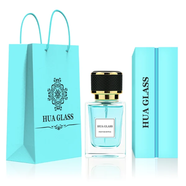 HUA0248 perfume bottle, rectangular transparent glass body with thick base, 50 ml or 100 ml liquid, cylindrical plastic cap wrapped with leather, gold-colored bottle neck, brand label applied on bottle, modern luxurious design, ideal for gifting and daily use.