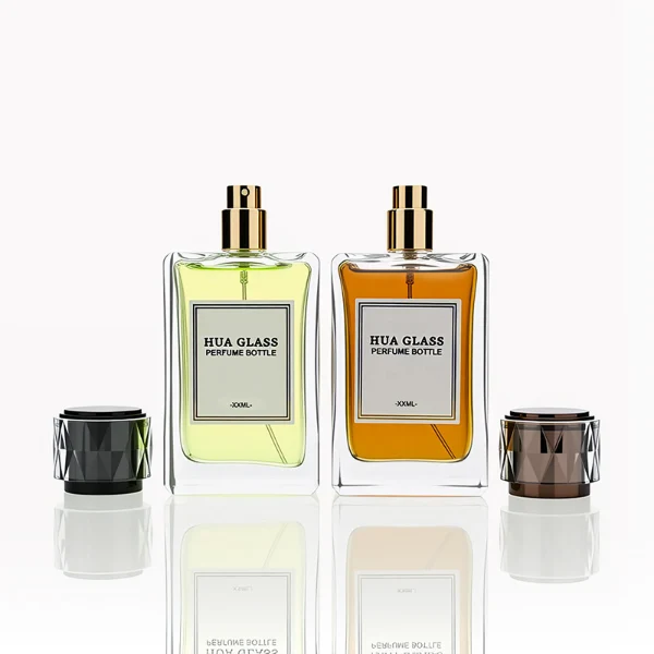 HUA0250 perfume bottle, rectangular transparent glass body with thick base, 100 ml liquid, black cylindrical plastic inner cap with transparent outer plastic, brand label applied on bottle, modern luxurious design, ideal for gifting and daily use.