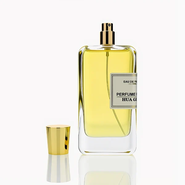 HUA0251 perfume bottle, rectangular transparent glass body with thick base, 100 ml liquid, cylindrical plastic cap with smooth high-gloss surface, flat top, straight uniform sides, tightly fitted to bottle neck, brand label applied on bottle, modern luxurious design, ideal for gifting and daily use.