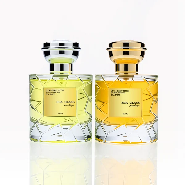 HUA0253 perfume bottle, faceted transparent glass body with geometric cut texture and thick base, 100 ml liquid, layered flat cylindrical cap with flat top, narrowed middle section and mirror metallic finish in gold or silver color matching the bottle neck, aluminum label/sticker applied on bottle, modern luxury design, ideal for gifting and daily use.