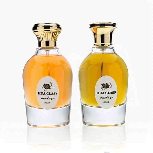 HUA0254 perfume bottle, rounded transparent glass body with smooth curved silhouette and thick base, 100 ml liquid, flared cylindrical Zamac cap with glossy finish, available in ribbed side texture or smooth side surface style, printed logo on bottle, elegant modern luxury design, ideal for gifting and daily use.