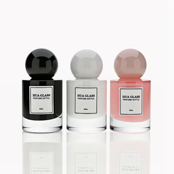 HUA0258 perfume bottle, internally sprayed cylindrical glass body with thick rounded base, 30 ml, 50 ml, or 100 ml liquid, oversized spherical plastic cap with glossy finish matching the internal spray glass color, customizable color design, printed logo label, modern minimalist luxury style, ideal for gifting and daily use.