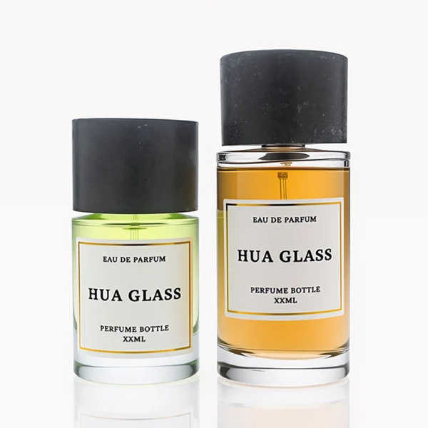 HUA0262 perfume bottle, cylindrical transparent glass body with thick rounded base, 30 ml, 50 ml, or 100 ml liquid, oversized flat cylindrical artificial stone cap with matte texture, printed logo label, modern minimalist luxury design, ideal for gifting and daily use.