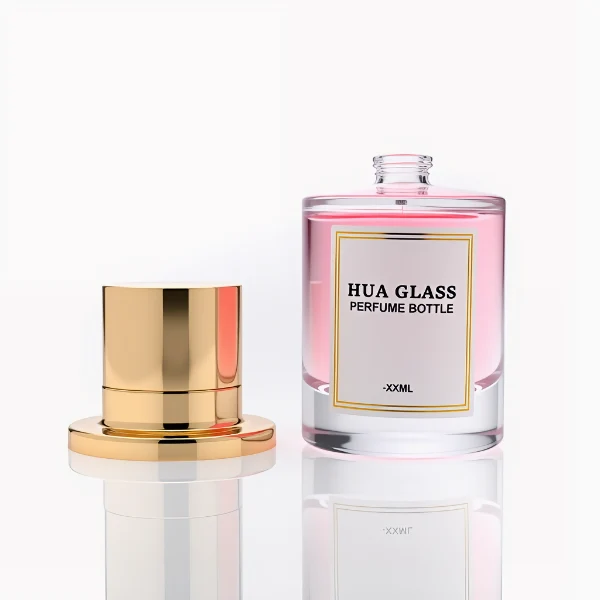 HUA0264 perfume bottle, cylindrical transparent glass body with thick rounded base, 50 ml or 100 ml liquid, stamp-shaped aluminum and magnet cap with glossy black or gold finish, printed logo label, modern luxury minimalist design, ideal for gifting and daily use.