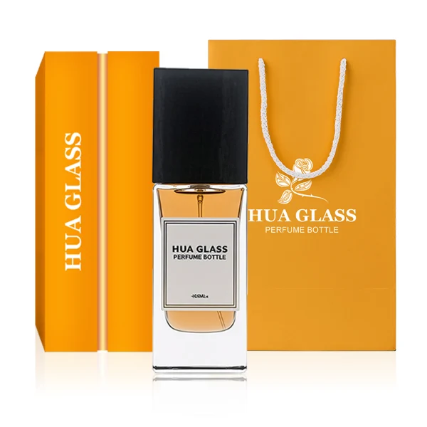 HUA0265 perfume bottle, rectangular transparent glass body with thick weighted base and rounded vertical edges, 30 ml, 50 ml, or 100 ml liquid, oversized rectangular plastic cap in wood-grain brown or matte black finish, printed logo label, modern minimalist luxury design, ideal for gifting and daily use.