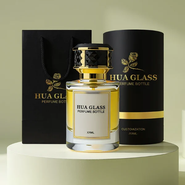 HUA0267 perfume bottle, cylindrical transparent glass body with thick rounded base, 30 ml, 50 ml, or 100 ml liquid, flat cylindrical plastic cap with faceted lattice side texture and gold or silver metallic striped decoration, printed logo label, modern luxury elegance design, ideal for gifting and daily use.