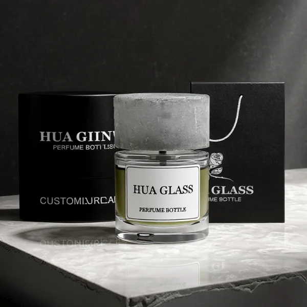 HUA0276 perfume bottle features a transparent colorless glass body with thick rounded base, smooth oval silhouette, and curved shoulder design, containing 80 ml of liquid. Finish: FEA15-crimp. Bottle Material: Glass. Bottle Color: Transparent, colorless. Bottle Shape: Oval body with rounded contours and thick base. Cap Style: Glossy spherical resin cap with marble-like texture in customizable colors. Cap Material: Resin. Surface Handling: Printed label attached on the bottle surface. Design Style: Modern elegant luxury. Ideal for personal fragrance use, gifting, and display.