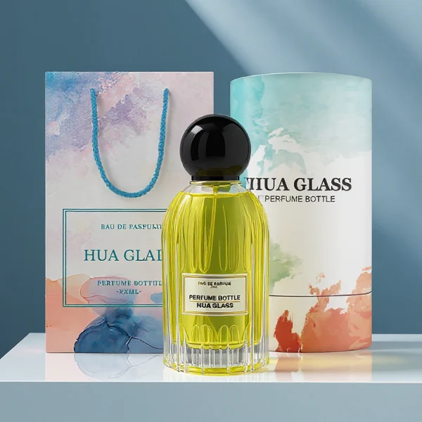 HUA0271 perfume bottle, cylindrical transparent glass body with vertical fluted texture and thick rounded base, 100 ml liquid, oversized spherical magnetic cap with glossy black or gold mirror finish, printed logo label, vintage luxury elegance design, ideal for gifting and daily use.