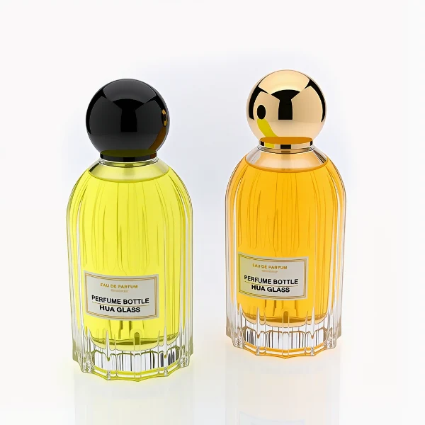 HUA0271 perfume bottle, cylindrical transparent glass body with vertical fluted texture and thick rounded base, 100 ml liquid, oversized spherical magnetic cap with glossy black or gold mirror finish, printed logo label, vintage luxury elegance design, ideal for gifting and daily use.