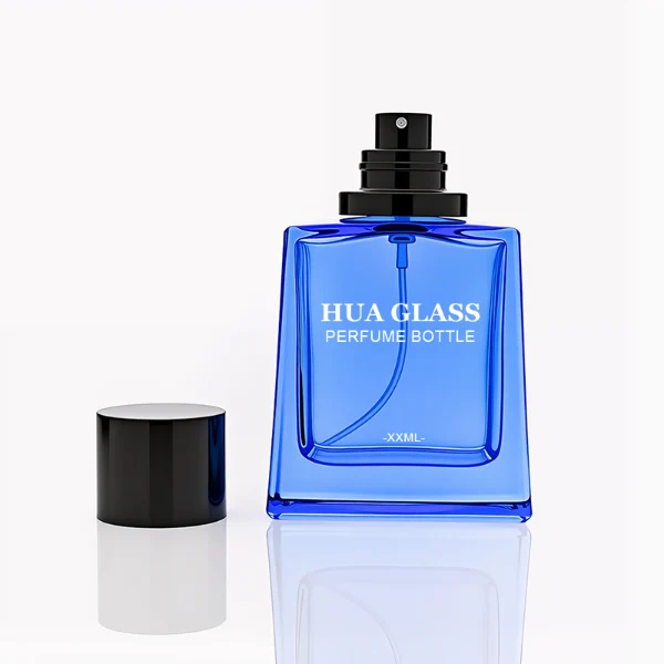 HUA0272 perfume bottle, semi-transparent blue or amber rectangular glass body with beveled edges and thick base, 35 ml, 50 ml, or 100 ml liquid, glossy cylindrical aluminum magnetic cap in gold or black, custom printed logo on bottle surface, modern luxury fashion design, ideal for gifting and daily use.