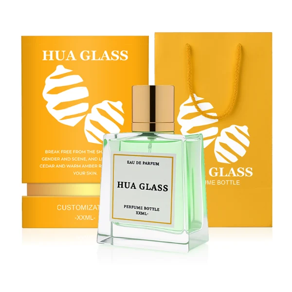 HUA0272 perfume bottle, semi-transparent blue or amber rectangular glass body with beveled edges and thick base, 35 ml, 50 ml, or 100 ml liquid, glossy cylindrical aluminum magnetic cap in gold or black, custom printed logo on bottle surface, modern luxury fashion design, ideal for gifting and daily use.