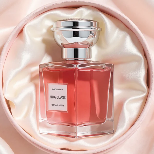 HUA0273 perfume bottle, transparent rectangular glass body with beveled edges and thick base, 50 ml or 100 ml liquid, glossy bowl-shaped plastic cap in silver or gold with matching bottle neck, brand label attached on bottle surface, modern elegant luxury design, ideal for gifting and daily use.