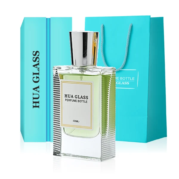 HUA0274 perfume bottle, transparent colorless rectangular glass body with rounded shoulders and thick base, 30 ml, 50 ml, or 100 ml liquid, glossy tapered cylindrical plastic cap in gold, silver, or white, printed label attached on bottle surface, modern minimalist luxury design, ideal for gifting and daily use.