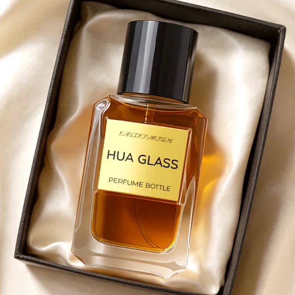 HUA0275 perfume bottle, transparent colorless octagonal glass body with beveled edges and thick base, 30 ml or 50 ml liquid, glossy black cylindrical plastic cap with flat top, aluminum label/sticker attached on bottle surface, modern minimalist luxury design, ideal for gifting and daily use.