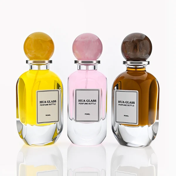 HUA0276 perfume bottle, transparent colorless oval glass body with rounded contours and thick base, 80 ml liquid, glossy spherical resin cap with marble-like texture in customizable colors, printed label attached on bottle surface, modern elegant luxury design, ideal for gifting and daily use.