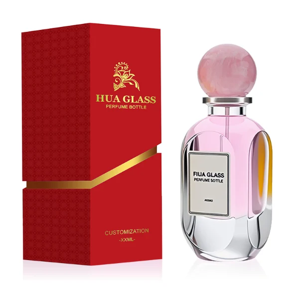 HUA0276 perfume bottle, transparent colorless oval glass body with rounded contours and thick base, 80 ml liquid, glossy spherical resin cap with marble-like texture in customizable colors, printed label attached on bottle surface, modern elegant luxury design, ideal for gifting and daily use.
