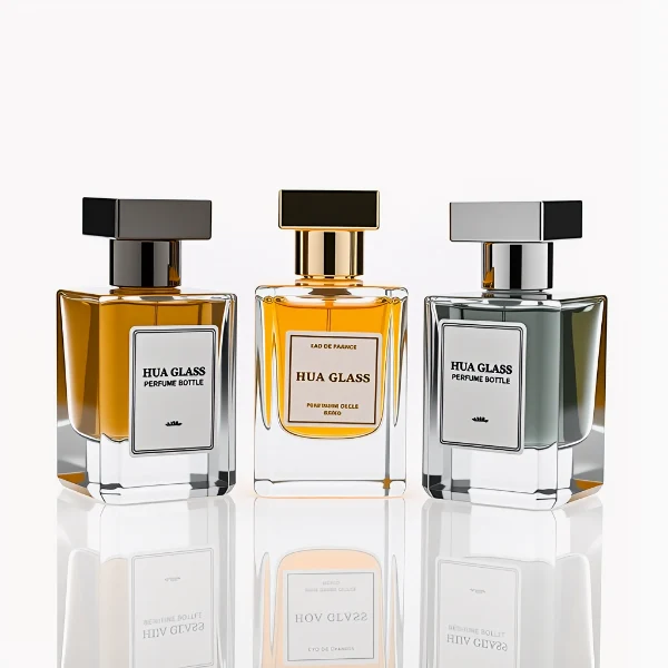 HUA0278 perfume bottle, transparent colorless rectangular glass body with angular edges and thick base, 30 ml, 50 ml, or 100 ml liquid, glossy black or silver square Zamac cap with matching bottle neck, printed label attached on bottle surface, modern masculine luxury design, ideal for gifting and daily use.