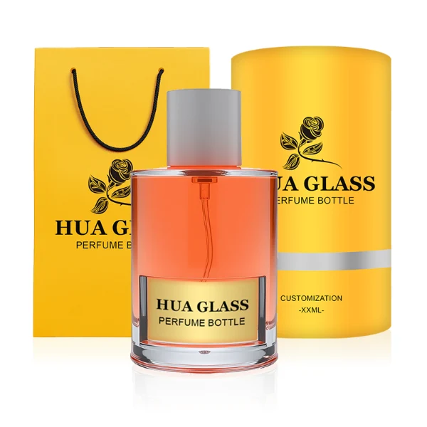 HUA0280 perfume bottle, cylindrical transparent glass body with thick base, 100 ml liquid, glossy flat cylindrical plastic cap in black or white, aluminum label/sticker attached on bottle surface, modern minimalist fashion design, ideal for gifting and daily use.