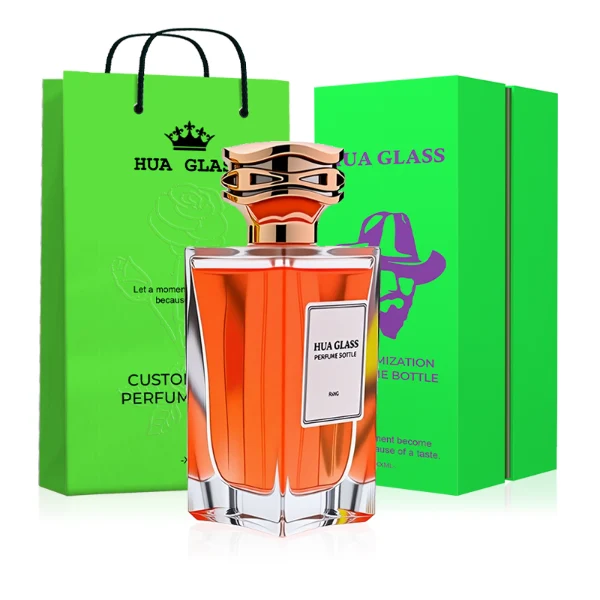HUA0284 perfume bottle, rectangular transparent colorless glass body with thick base and beveled edges, 100 ml liquid, cylindrical glossy plastic cap with wave-pattern side texture in gold or rose gold finish, printed label attached on bottle surface, modern luxurious fashion design, ideal for gifting and daily use.