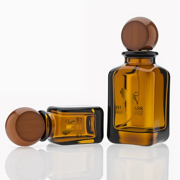 HUA0290 perfume bottle, rounded rectangular semi-transparent amber glass body with thick base and smooth edges, 30 ml, 50 ml, or 100 ml liquid, flattened spherical wooden cap with natural wood texture, gold printed logo on bottle surface, modern vintage luxury design, ideal for gifting and daily use.