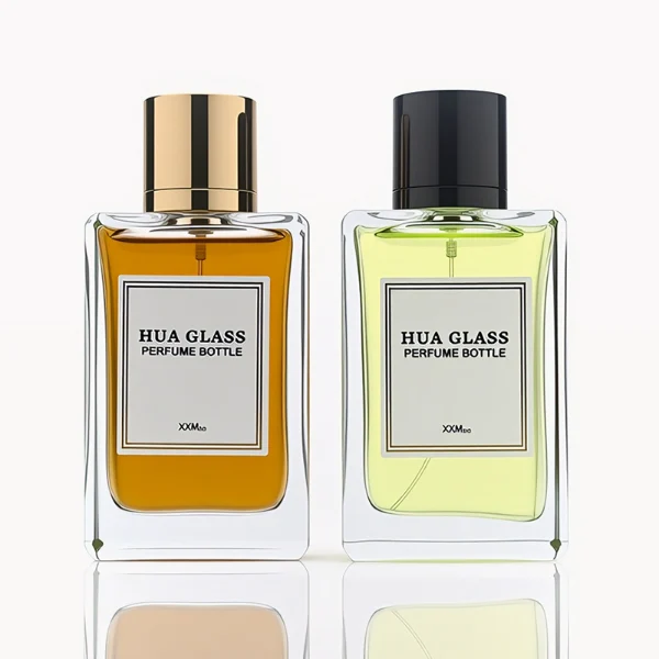 HUA0291 perfume bottle, rectangular transparent colorless glass body with thick base and beveled edges, 100 ml liquid, glossy cylindrical aluminum cap in gold or black finish, printed label attached on bottle surface, modern minimalist luxury design, ideal for gifting and daily use.