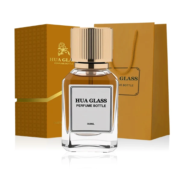 HUA0292 perfume bottle, transparent colorless octagonal beveled glass body with thick base and angled faceted edges, 30 ml, 50 ml, or 100 ml liquid, glossy gold cylindrical aluminum cap with matching gold bottle neck, printed label attached on bottle surface, modern elegant luxury design, ideal for gifting and daily use.