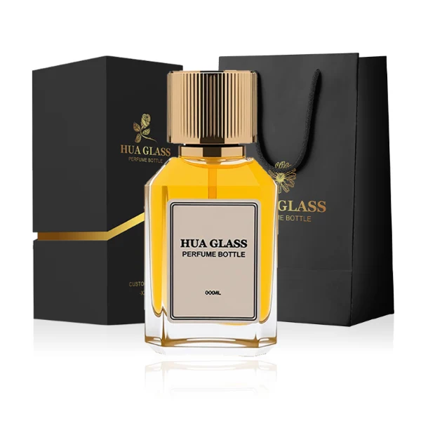 HUA0292 perfume bottle, transparent colorless octagonal beveled glass body with thick base and angled faceted edges, 30 ml, 50 ml, or 100 ml liquid, glossy gold cylindrical aluminum cap with matching gold bottle neck, printed label attached on bottle surface, modern elegant luxury design, ideal for gifting and daily use.
