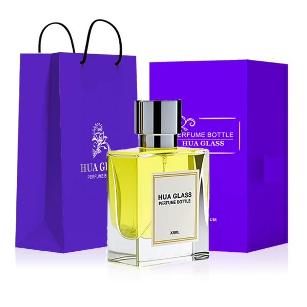 HUA0294 perfume bottle, square transparent colorless glass body with thick base and beveled edges, 50 ml liquid, glossy cylindrical Zamac cap in black, gold, or silver finish with matching bottle neck, printed label attached on bottle surface, modern minimalist luxury design, ideal for gifting and daily use.