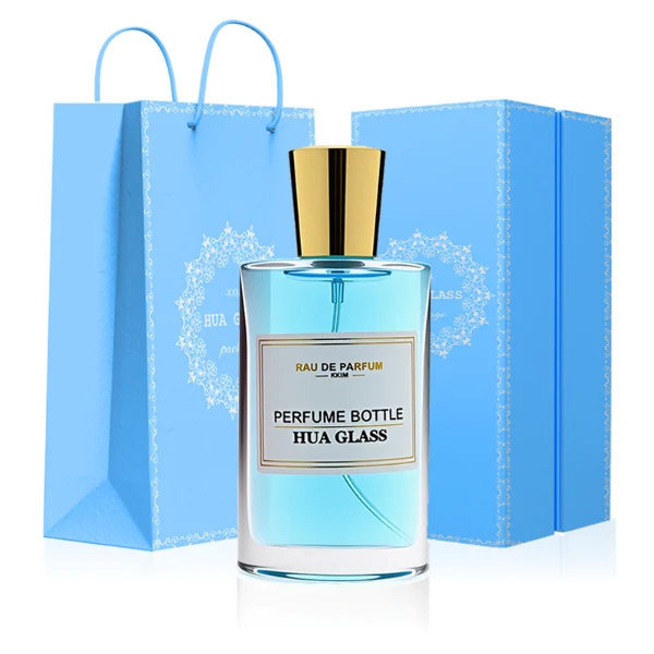 HUA0295 perfume bottle, rectangular handbag-shaped transparent colorless glass body with rounded corners and thick base, 50 ml liquid, glossy tapered cylindrical plastic cap in gold or silver finish, printed label attached on bottle surface, modern elegant luxury design, ideal for gifting and daily use.