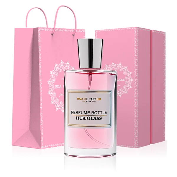 HUA0295 perfume bottle, rectangular handbag-shaped transparent colorless glass body with rounded corners and thick base, 50 ml liquid, glossy tapered cylindrical plastic cap in gold or silver finish, printed label attached on bottle surface, modern elegant luxury design, ideal for gifting and daily use.