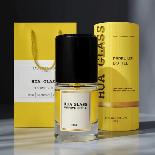 HUA0296 perfume bottle, cylindrical transparent colorless glass body with thick base and smooth rounded silhouette, 30 ml, 50 ml, or 100 ml liquid, cylindrical wooden cap in natural wood or matte black finish, printed label attached on bottle surface, modern minimalist luxury design, ideal for gifting and daily use.