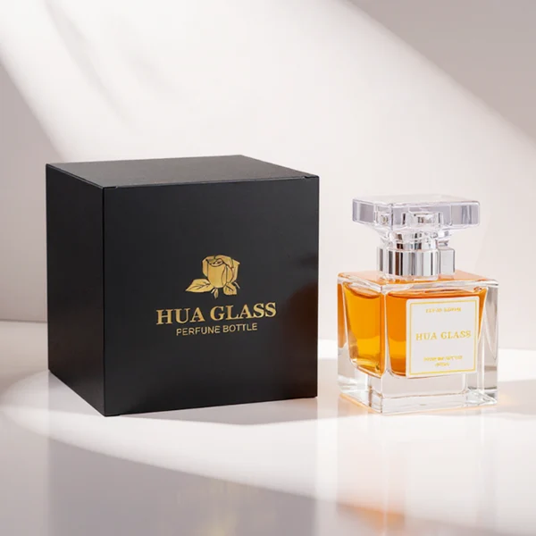 HUA0300 perfume bottle, rectangular transparent colorless glass body with thick base and smooth surface, 30 ml, 50 ml, or 100 ml liquid, flat multifaceted plastic cap with silver bottle neck, printed label attached on bottle surface, modern elegant luxury design, ideal for gifting and daily use.