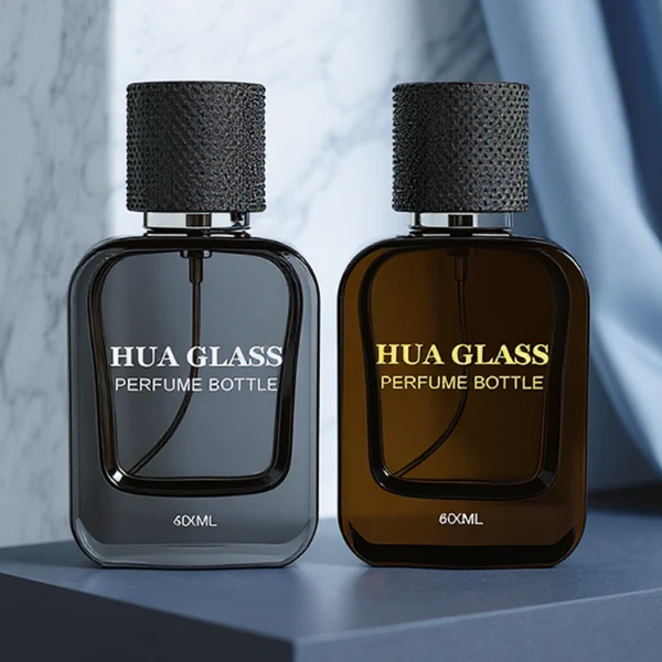 HUA0302 perfume bottle, rounded rectangular glass body with thick base in transparent, semi-transparent black, or amber color, 30 ml, 50 ml, or 100 ml liquid, cylindrical plastic cap with gold or silver bottle neck, printed logo or blank bottle surface, modern minimalist luxury design, ideal for gifting and daily use.