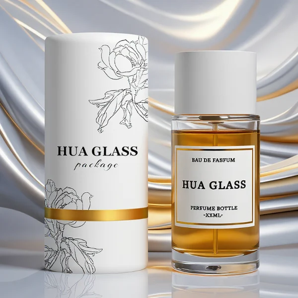 HUA0304 perfume bottle, cylindrical transparent colorless glass body with thick rounded base and smooth curved silhouette, 30 ml, 50 ml, or 100 ml liquid, glossy white cylindrical plastic cap with flat top, printed label attached on bottle surface, modern minimalist luxury design, ideal for gifting and daily use.
