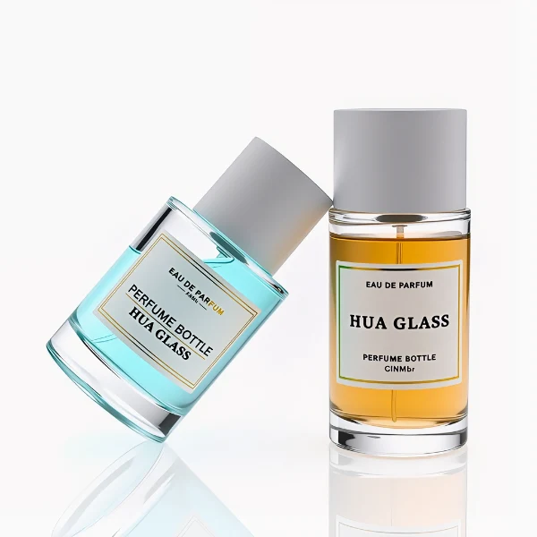HUA0304 perfume bottle, cylindrical transparent colorless glass body with thick rounded base and smooth curved silhouette, 30 ml, 50 ml, or 100 ml liquid, glossy white cylindrical plastic cap with flat top, printed label attached on bottle surface, modern minimalist luxury design, ideal for gifting and daily use.