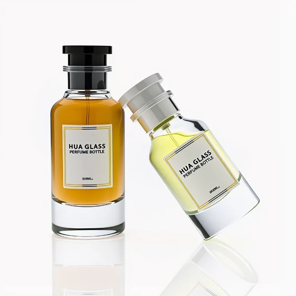 HUA0305 perfume bottle, cylindrical transparent colorless glass body with thick rounded base and curved shoulders, 50 ml or 100 ml liquid, stopper-shaped cylindrical plastic cap in black or white finish, printed label attached on bottle surface, modern minimalist luxury design, ideal for gifting and daily use.