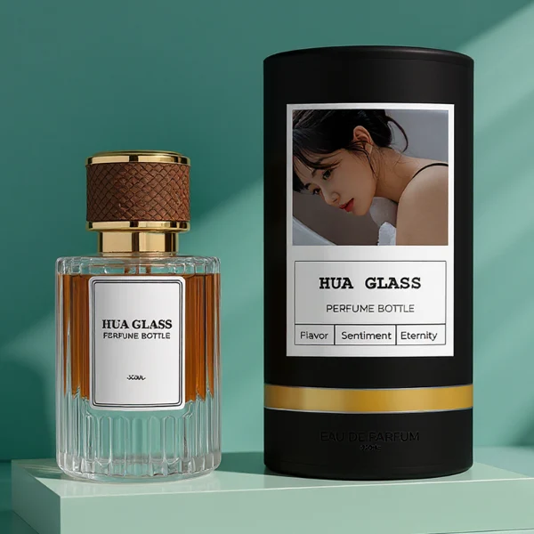HUA0307 perfume bottle, cylindrical transparent colorless glass body with vertical ribbed texture and thick base, 30 ml, 50 ml, or 100 ml liquid, gold plastic cylindrical cap wrapped with black or brown leather, printed label attached on bottle surface, modern vintage luxury design, ideal for gifting and daily use.