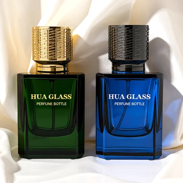 HUA0308 perfume bottle, semi-transparent blue or dark green customizable glass body with thick base and clean rectangular silhouette, 30 ml, 50 ml, or 100 ml liquid, textured cylindrical plastic cap in gold or black finish, gold or white printed logo on bottle surface, modern masculine luxury design, ideal for gifting and daily use.